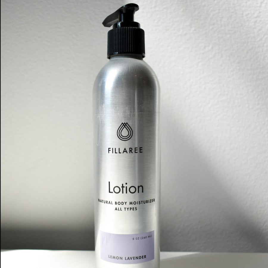 metal lotion bottle on white backdrop
