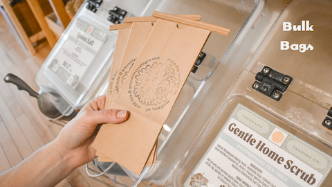 Paper bags stamped with Green Life Trading Co logo