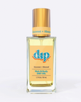 glass bottle with gold top and yellow label says coconut almond hair and body dry oil on white backgroun