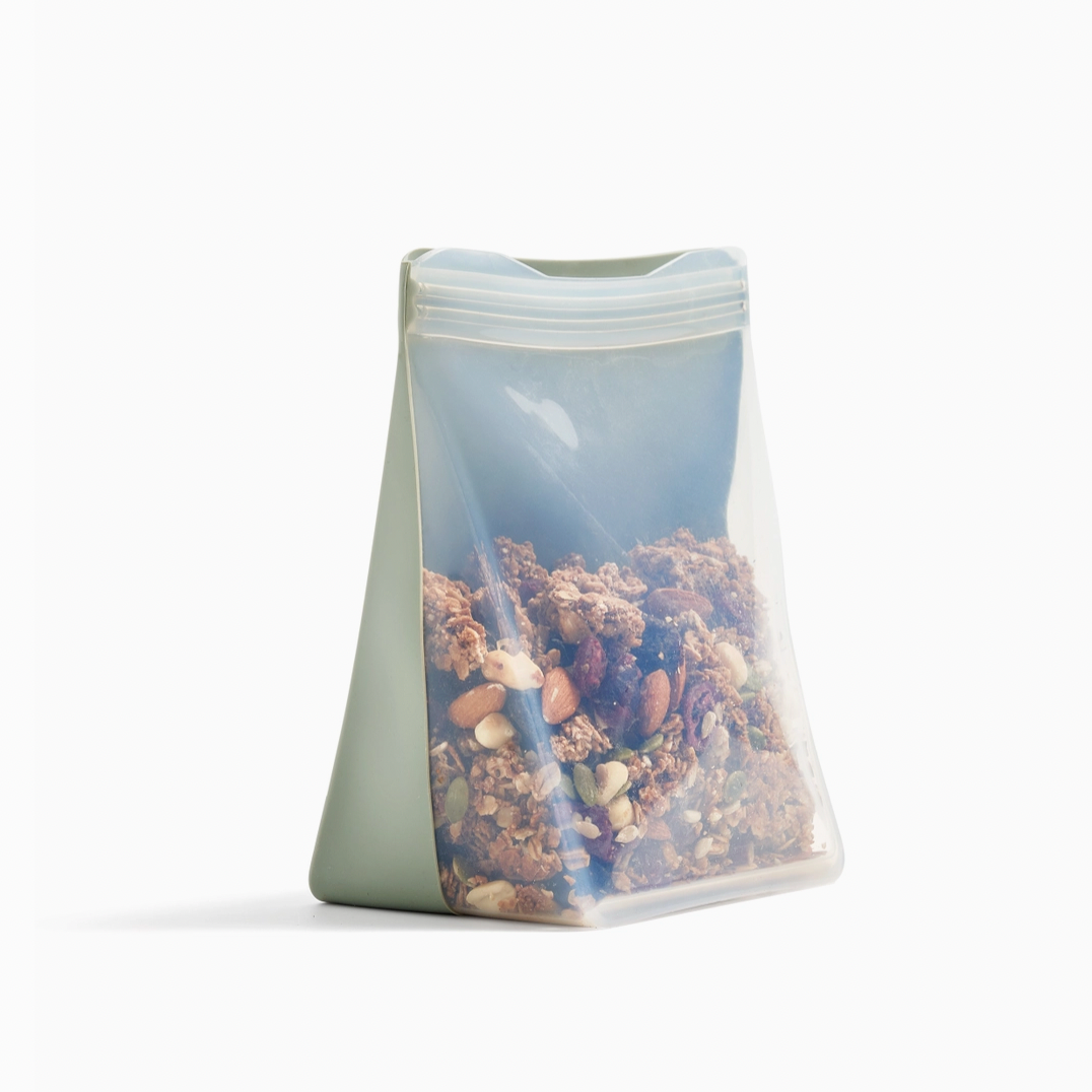 green and clear silicone bag filled with granola 