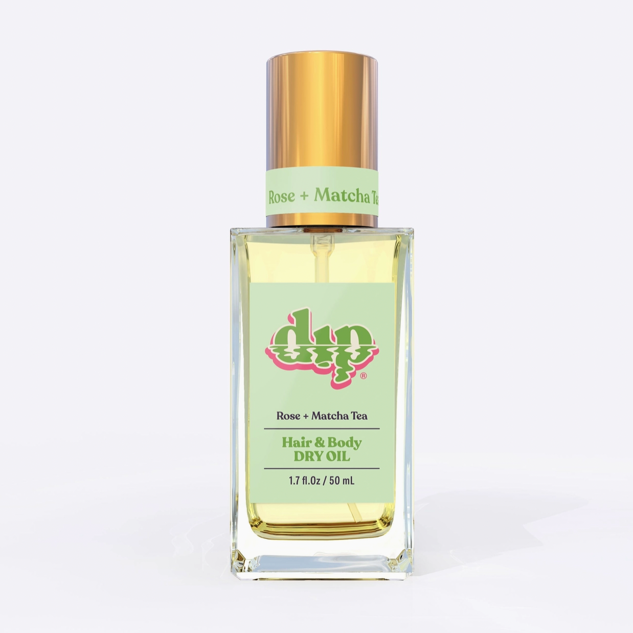 Square glass bottle with gold top and green label says rose matcha hair and body dry oil on white background