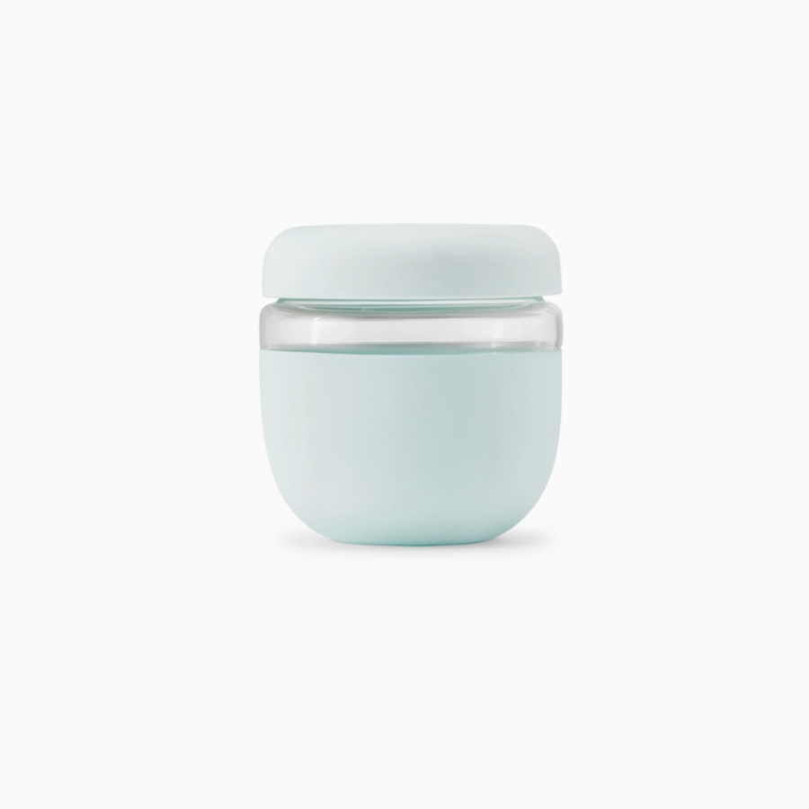 silicone and glass container on white backdrop