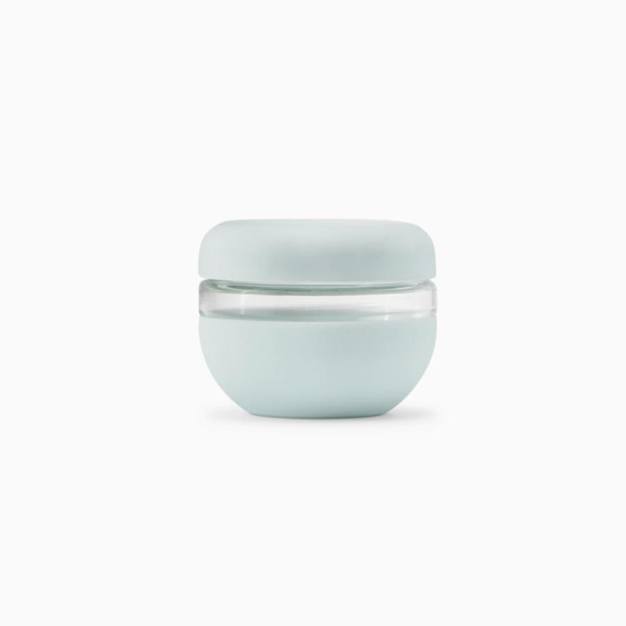 silicone and glass container on white backdrop