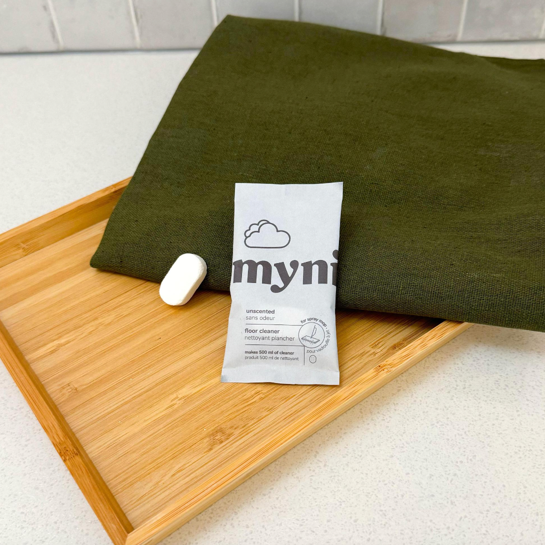 package of floor cleaning tablet on towel 